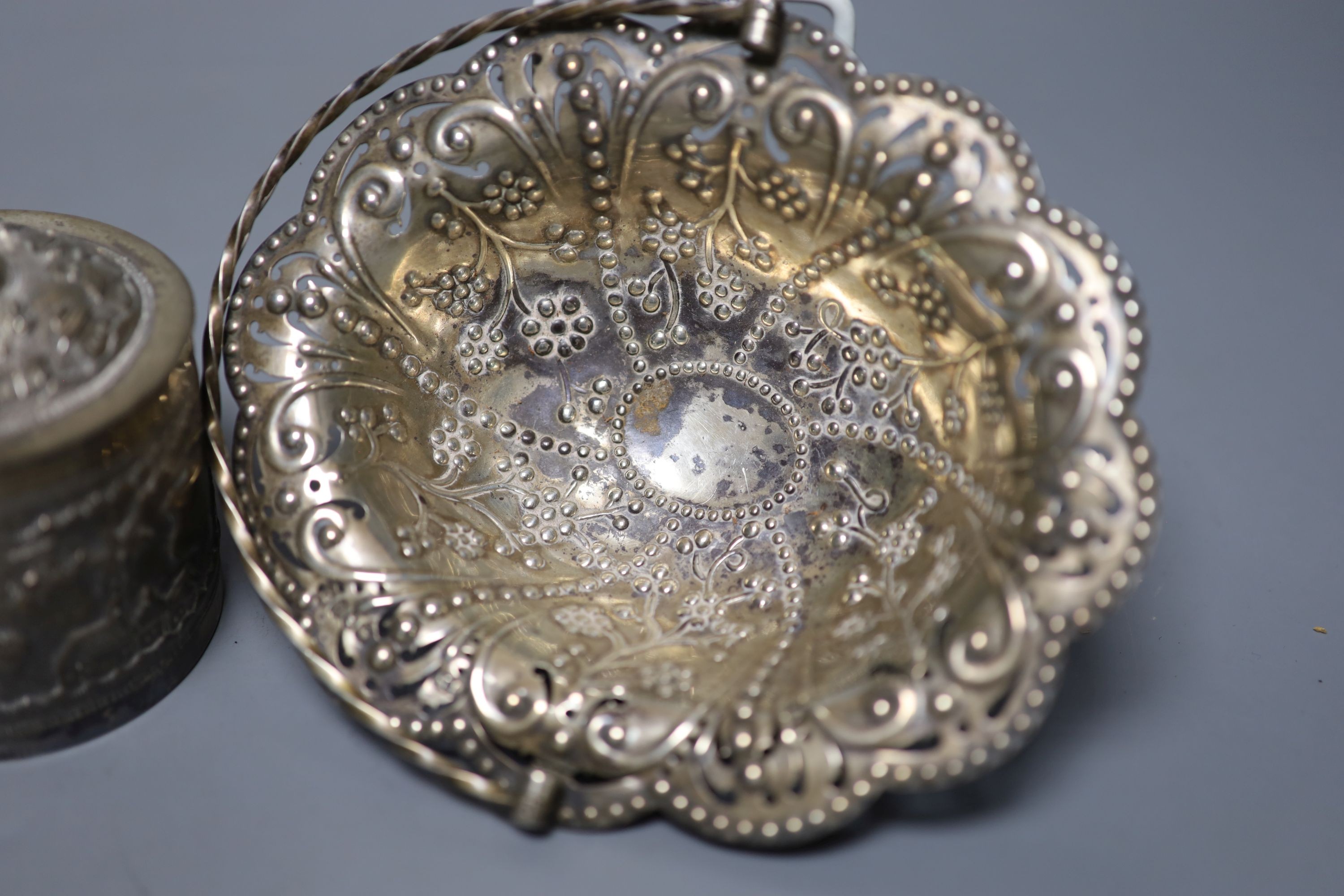 A late Victorian pierced silver basket, London, 1882, 15.7cm, a similar silver octagonal box and an Indian white metal box and cover.